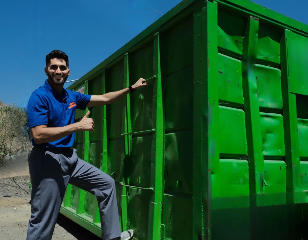 Zippy Dumpster truck delivering dumpster in Long Beach, CA driveway